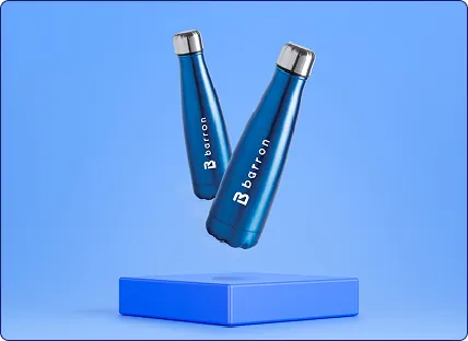 Two metallic blue Barron branded stainless steel water bottles displayed on a blue platform showcasing premium promotional merchandise